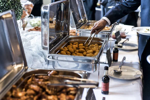 BBQ Chicken wings and nuggets with spicy sauce during a business meeting buffet — Stock Photo, Image