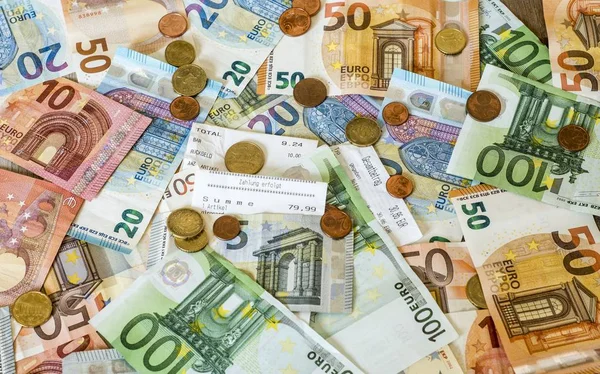 savings Cash money concept euro banknotes all sizes and cent coins on desk bill pay store text sum total save