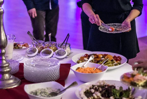 People group catering buffet at food table luxury restaurant with meat, bread and different salad — Stock Photo, Image