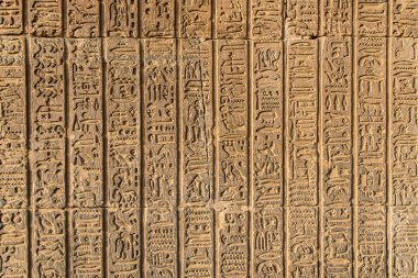 Ruins and Hieroglyphs in the famous Temple of Kom Ombo in Egypt on nile river bank clipart