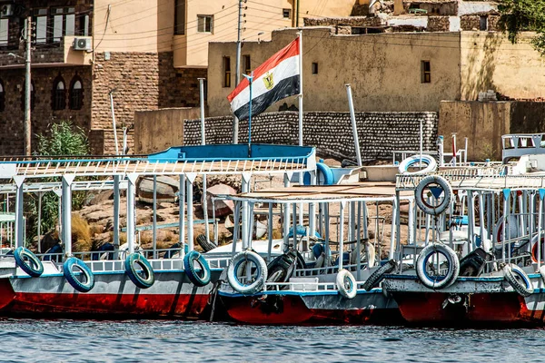 Marina Philae EGYPT Egyptian flag on Tourists boats to Philea temple UNESCO moved temple because of the Aswan Dam — Stock Photo, Image