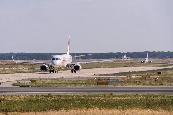 FRANKFURT, GERMANY 11.08.2019 French HOP Airlines F-HBLC Embraer E190LR start departure at fraport airport — стоковое фото