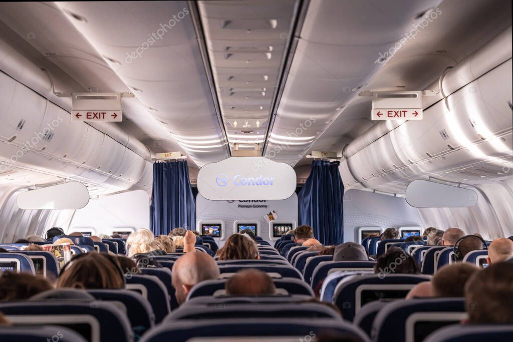 Frankfurt Germany 18.11.19 Condor Air airplane logo passengers and Board Crew inside a Boeing Airplane.