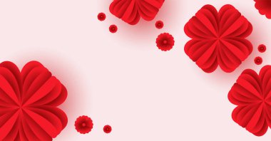 Pembe arka planda uçan çiçek şeklindeki kağıt elementler.