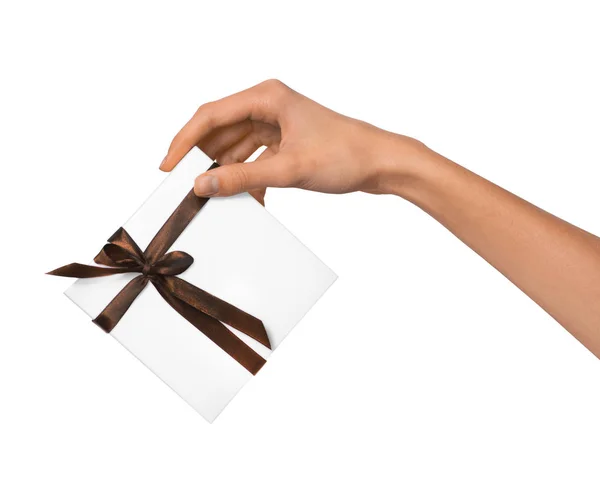 Kobieta ręka trzyma Holiday Present Box biały brązowy wstążką — Zdjęcie stockowe