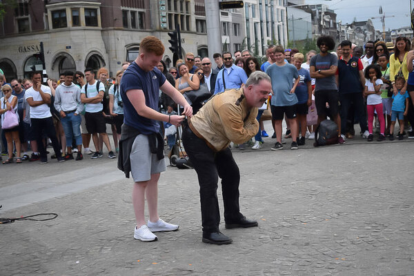 Street artist locked in chain in Amsterdam