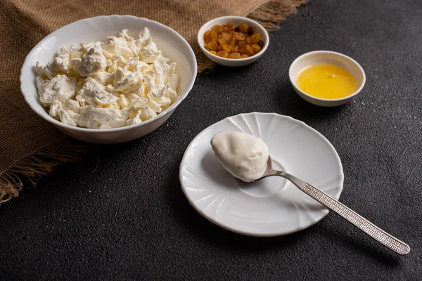 Cottage Cheese White Plate Spoon Sour Cream Dark Background Farm — Stock Photo, Image