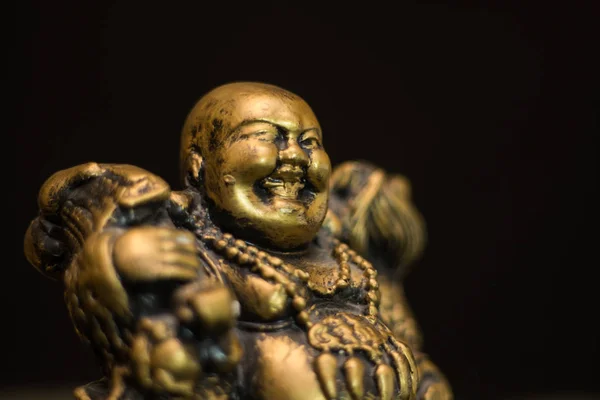 Chinese figurine Hotei, the laughing Buddha is a symbol of prosperity and money