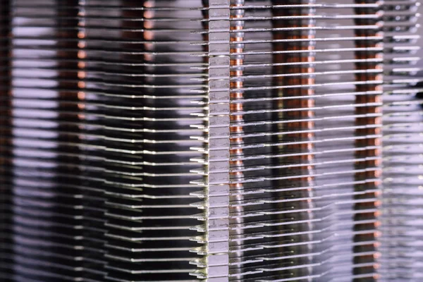 Aluminum radiator with copper heat pipe close-up with beautiful bokeh