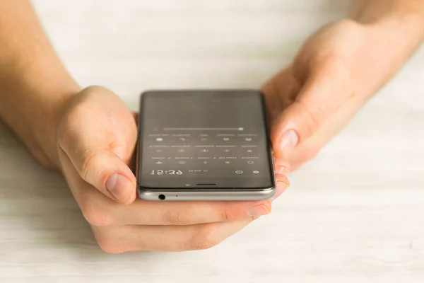 black smartphone a touch screen Man using smart phone hands