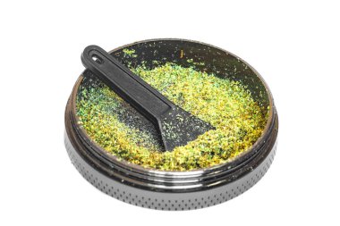 isolated Kief in grinder Trichomes buds of Cannabis for weed macro clipart