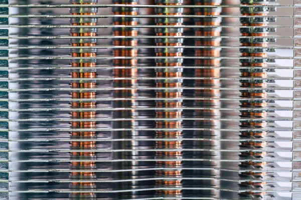 Aluminum radiator with copper heat pipe close-up with beautiful bokeh