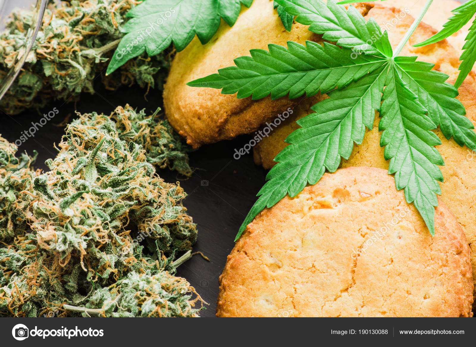 Cookies With Leaves Of Cannabis And Buds Of Marijuana On The Table A Can Of Cannabis Buds Concept Of Cooking With Cannabis Herb Treatment Of Medical Marijuana For Use In Food On