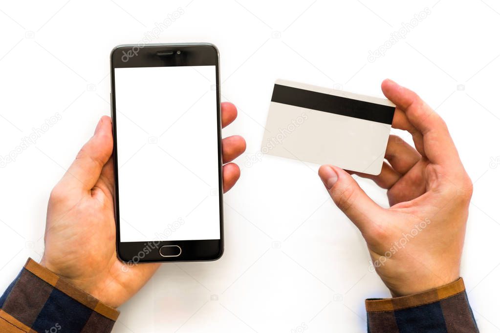smartphone mock up and a credit card in the hands of Closeup photo businessman holding hand credit card and using smartphone. Online payments plastic card. Horizontal mockup. Blurred, film effect
