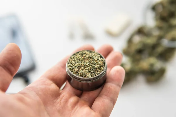 Grinder Fresh Weed Hand Cannabis Buds White Table Joint Marijuana — Stock Photo, Image