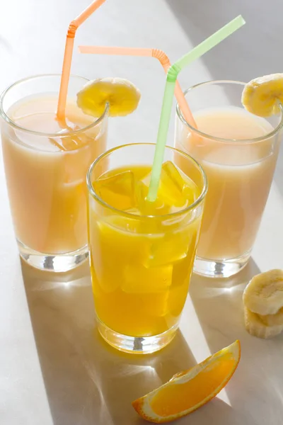 Glass of orange and banana juice — Stock Photo, Image