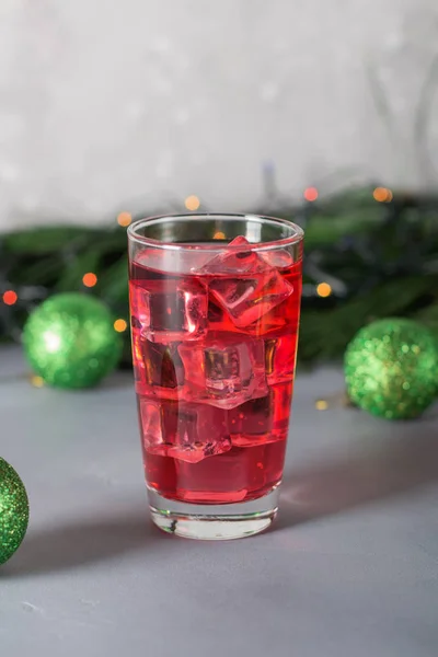 Glass of mango dragonfruit refresher drink on table with ice cubes. Copy space. — Stock Photo, Image