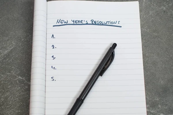 Pen Notebook List New Years Resolutions Stock Image