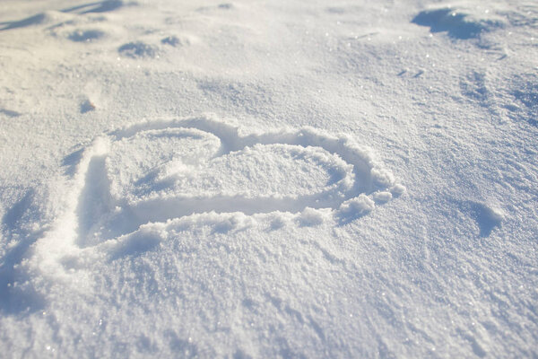 Heart drawn on the snow.
