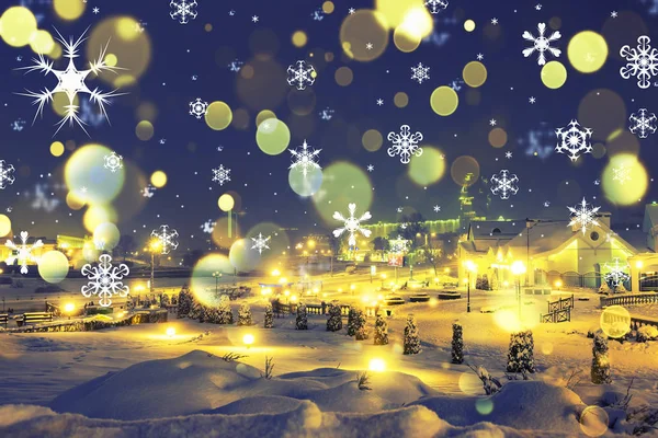 Magical Christmas night. Snowflakes and Lights in city for Christmas. Theme of Christmas and New Year. Night landscape of fairy city in Xmas — Stock Photo, Image