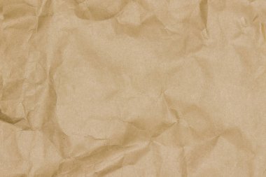 Eski kahverengi buruşuk dokulu kağıt.