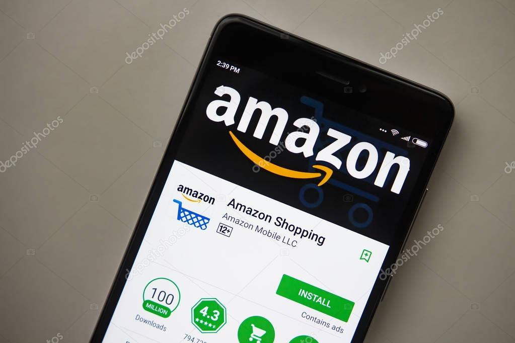 Berlin, Germany - November 19, 2017: Amazon application on screen of modern smartphone close-up. Install menu of Amazon app in Play Store. Shopping apps on display of phone