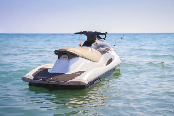 Water motorcycle in the blue sea on clear sunny day. Water bike on waves of sea. — Stock Photo, Image