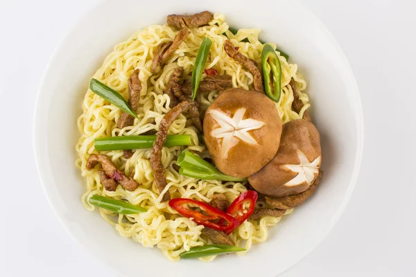 Fried noodles with meat and mushrooms — Stock Photo, Image