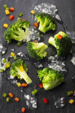 Boiled broccoli with sauce clipart