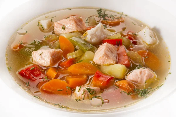 Soupe claire de légumes au saumon — Photo