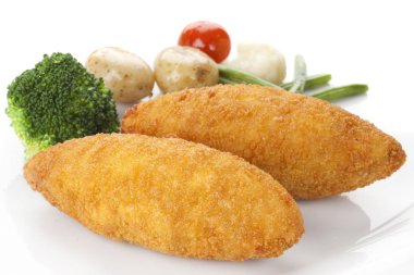 Chicken Kiev with vegetables clipart
