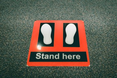 Stand here symbol in security checkpoint at airport. clipart