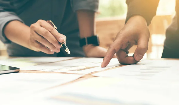 Close up of group start-up analysis to data paper chart on desk — Stock Photo, Image