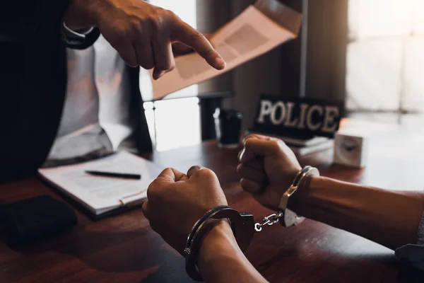 Police Officer Pointed Handcuffs Held Documents Arrest Accused Fraud Case — Stock Photo, Image