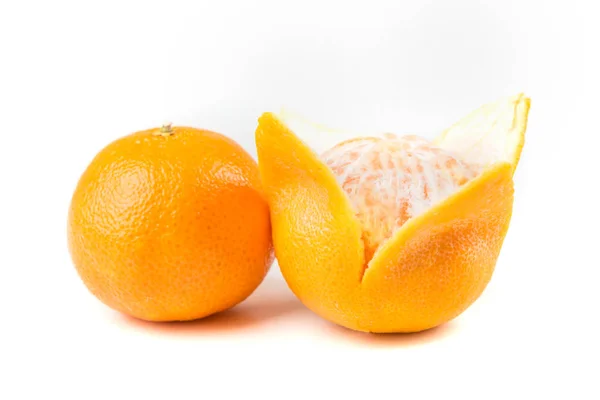 Two navel oranges one peeled one unpeeled — Stock Photo, Image