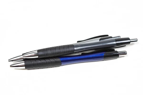 Penne da scrittura nere e blu — Foto Stock