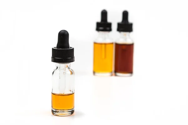 Flavored vape juice with shallow depth of field and objects out of focus — Stock Photo, Image