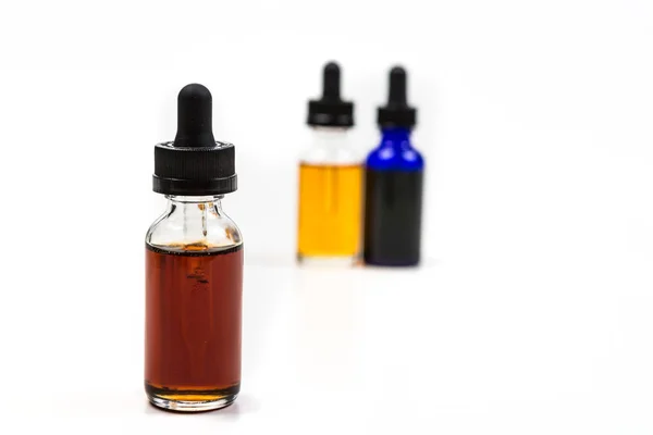 Flavored vape juice with shallow depth of field and objects out of focus — Stock Photo, Image