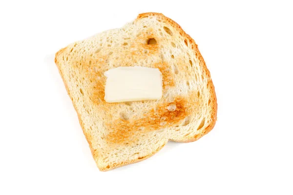 Geröstetes Vollkornbrot mit einem Stück Butter — Stockfoto