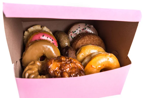 An assorted dozen donuts in a box