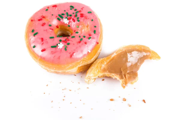 Donuts partiellement consommés avec une bouchée prise — Photo
