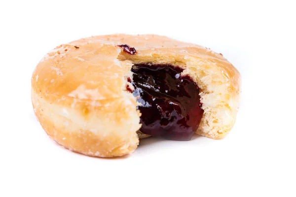 A frosted jelly filled donut with a bite out of it — Stock Photo, Image