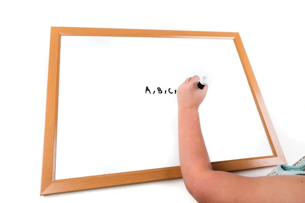 Child writing on a dry erase board — Stock Photo, Image