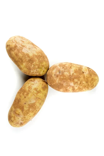 Три картошки изолированы — стоковое фото