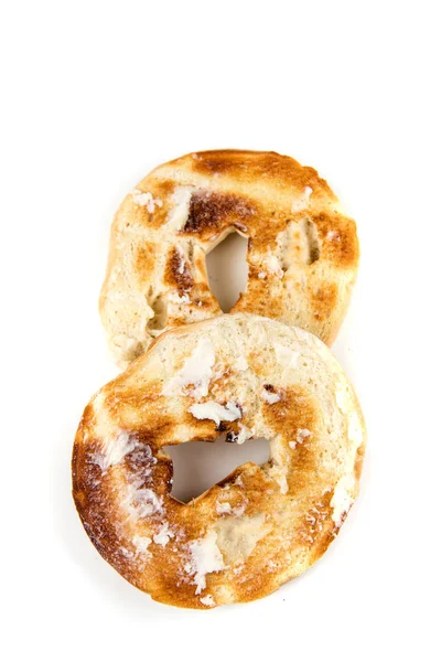 Plain white toasted buttered bagels — Stock Photo, Image