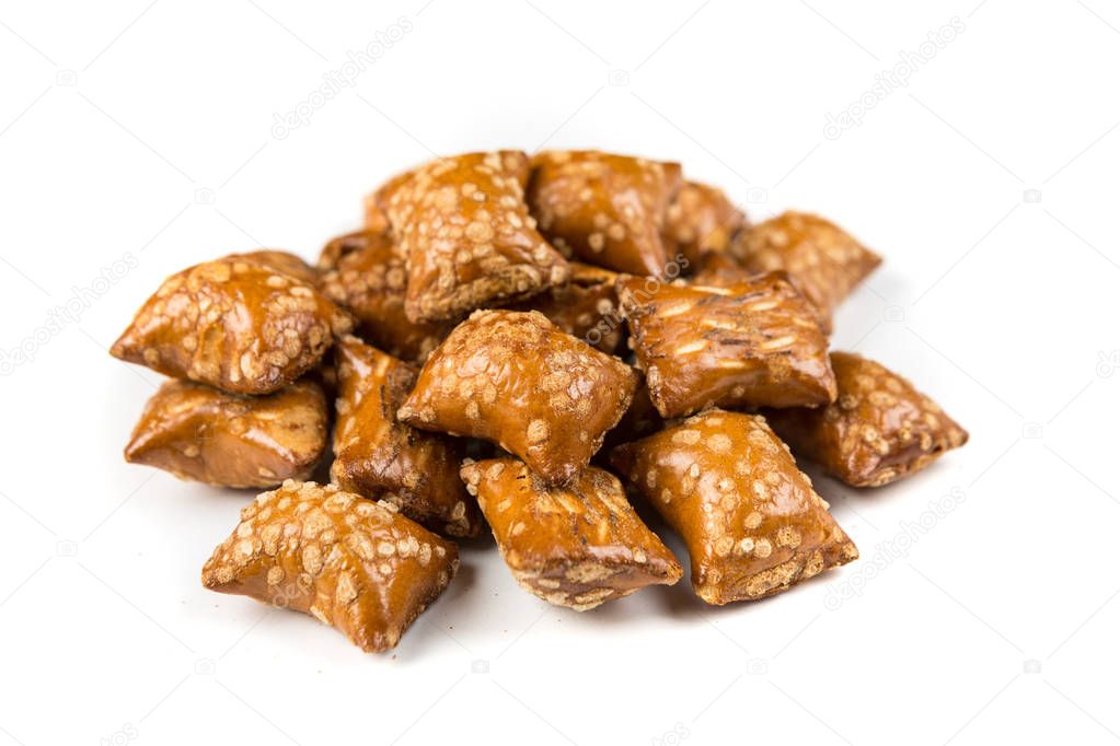 Pile of peanut butter filled pretzels isolated on a white background