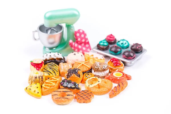 Childs toy plastic foods molded 1/6th scale assorted baked goods and stand mixer shallow depth of field
