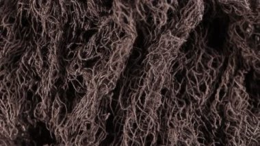 Siyah açık kumaş kumaş 4k video saat yönünde dönen yavaşça aşağı görünüm