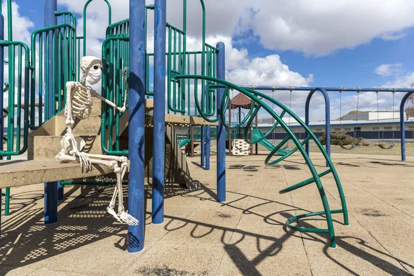 Skeleton Sitting Childs Toy Empty Closed Park Nice Day — Stock Photo, Image