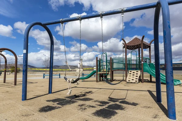 Skeleton Swinging Childs Toy Empty Closed Park Nice Day — Stock Photo, Image